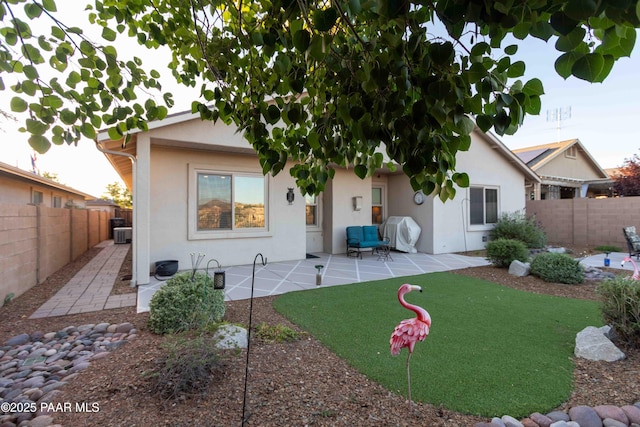 12933 Ponce St, Dewey-Humboldt, AZ 86327 - back of property featuring stucco siding, a fenced backyard, and a patio area