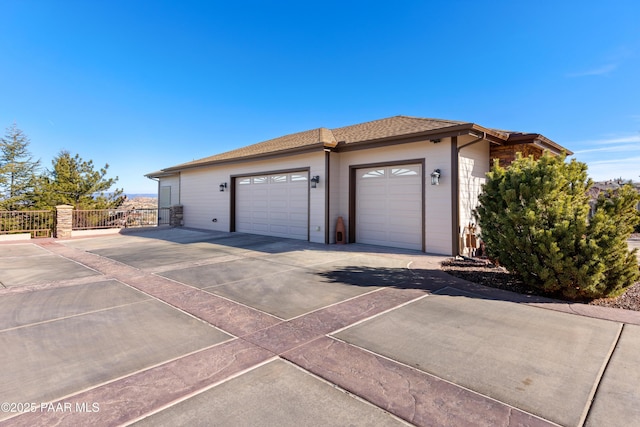 view of side of property with a garage