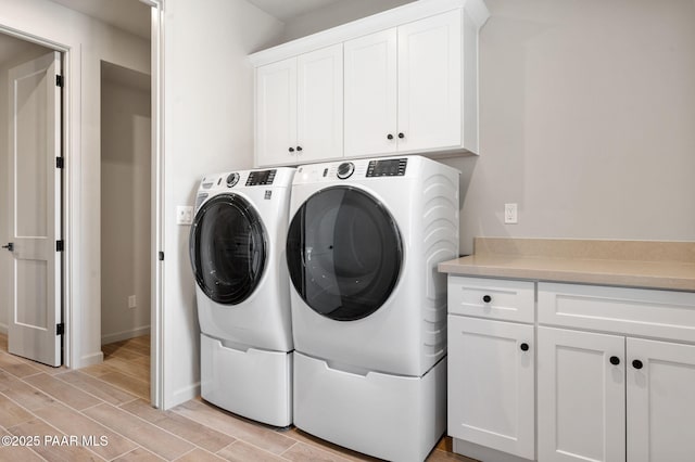 5734 E Hahn St, Prescott Valley, AZ 86314 - laundry room with washing machine and clothes dryer, wood finish floors, cabinet space, and baseboards
