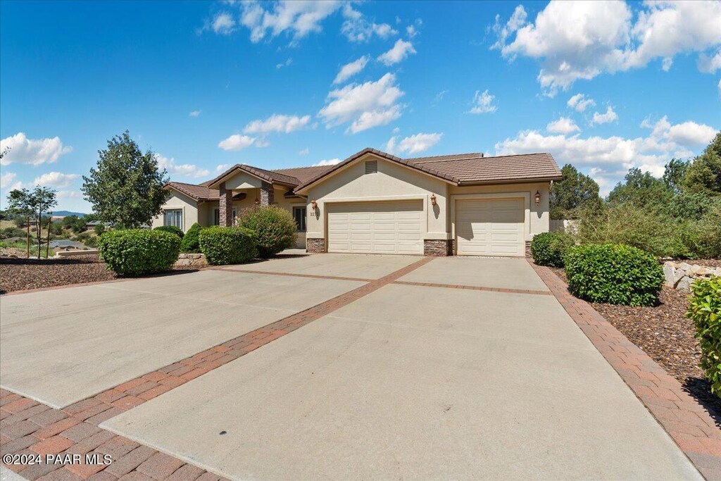 single story home with a garage