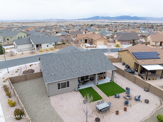 birds eye view of property with a residential view and a mountain view