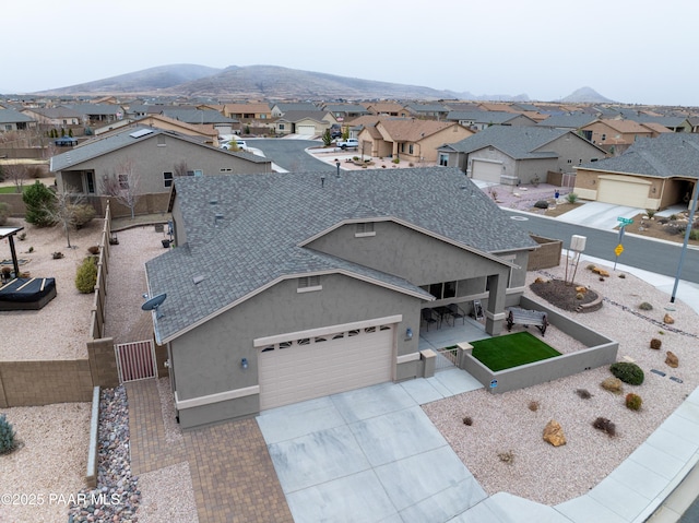 birds eye view of property with a residential view and a mountain view