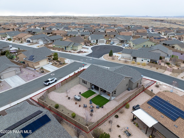 birds eye view of property with a residential view