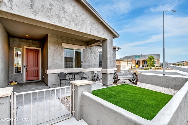 doorway to property with stucco siding