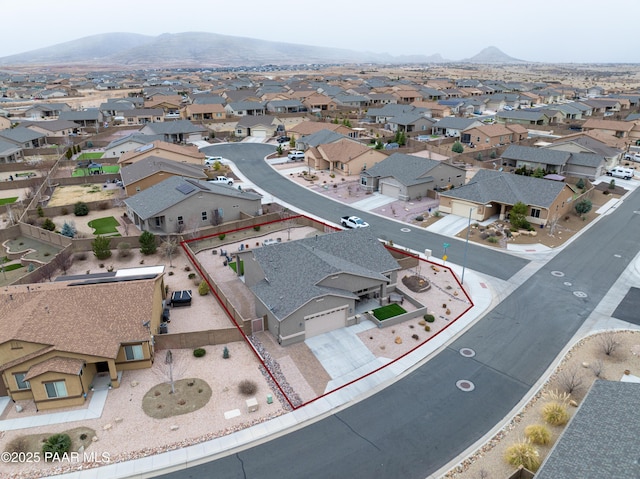 birds eye view of property with a mountain view and a residential view