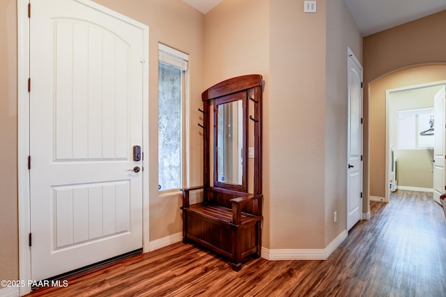 entrance foyer with wood finished floors and baseboards