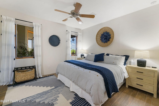 bedroom featuring dark hardwood / wood-style floors and ceiling fan