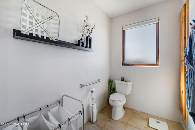 bathroom featuring tile patterned floors and toilet