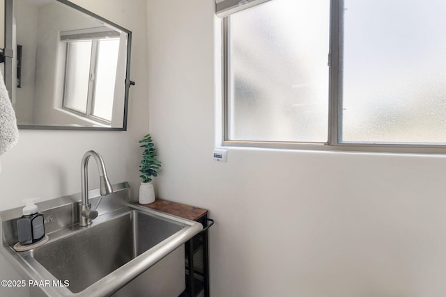 bathroom featuring a healthy amount of sunlight and sink