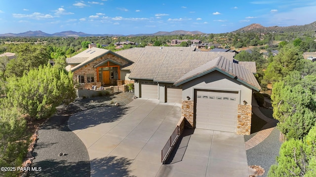 ranch-style home featuring a mountain view and a garage