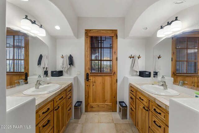 bathroom with vanity and plenty of natural light