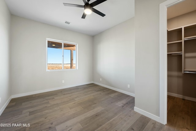 unfurnished bedroom with a closet, ceiling fan, and light hardwood / wood-style flooring