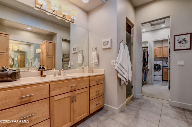 1690 Stable Rock Rd, Prescott, AZ 86303 - bathroom with vanity, washer / dryer, tile patterned flooring, and baseboards