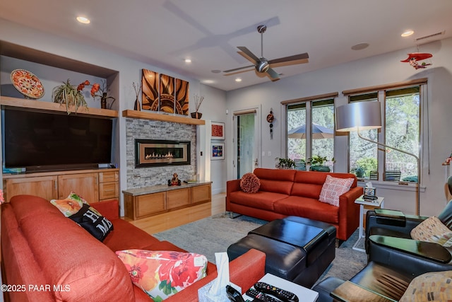 1690 Stable Rock Rd, Prescott, AZ 86303 - living area featuring recessed lighting, a fireplace, a ceiling fan, visible vents, and wood finished floors