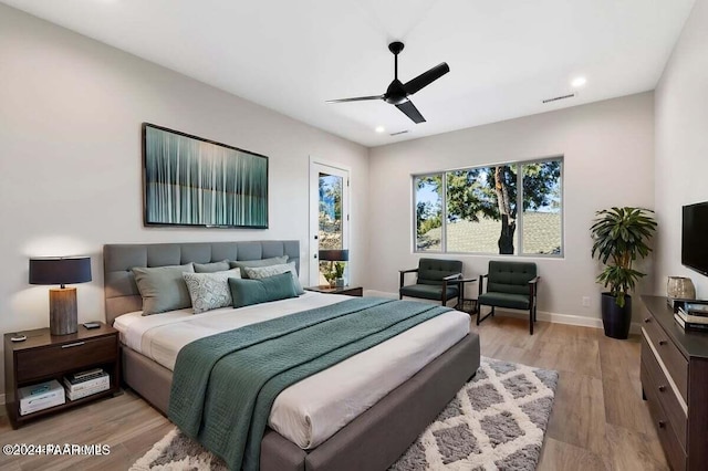 bedroom with ceiling fan and light hardwood / wood-style flooring