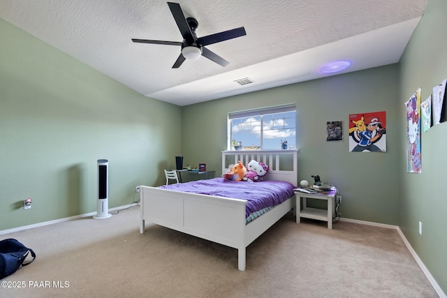 12673 E Amor St, Dewey-Humboldt, AZ 86327 - bedroom with a textured ceiling, carpet floors, an office area, baseboards, and a ceiling fan