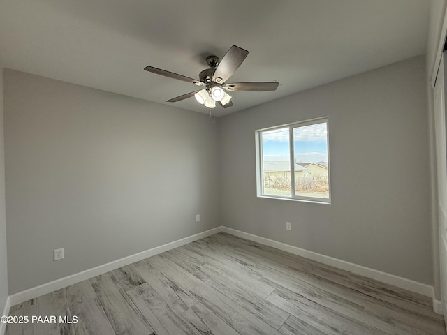 unfurnished room featuring ceiling fan and light wood-type flooring