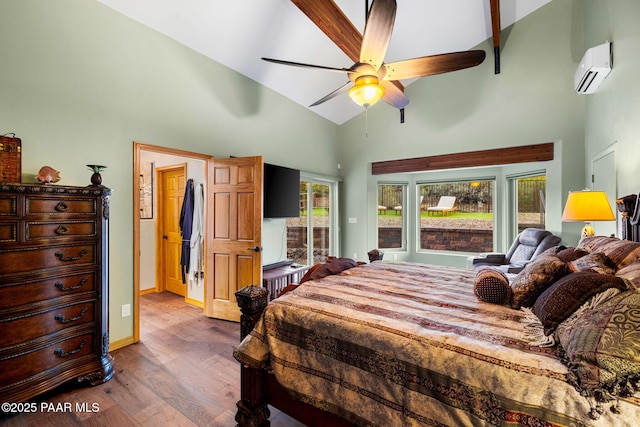 bedroom with hardwood / wood-style flooring, a wall mounted air conditioner, high vaulted ceiling, and ceiling fan