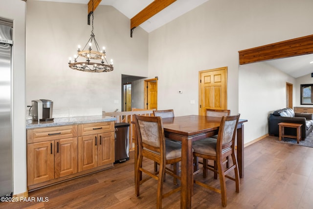 dining space with high vaulted ceiling, dark wood-type flooring, beam ceiling, and a notable chandelier