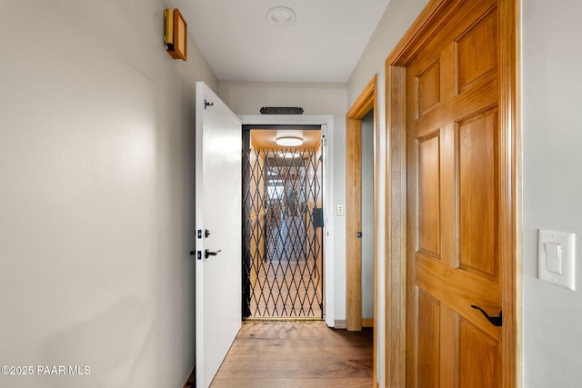 hall with light wood-type flooring