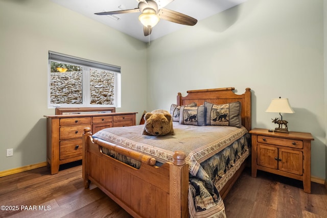 bedroom with dark wood-type flooring and ceiling fan