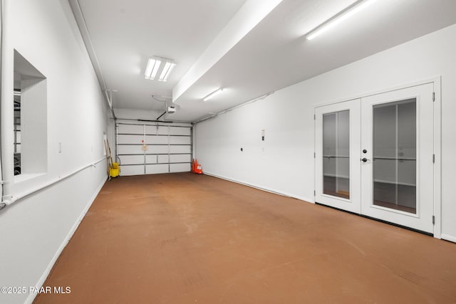 garage featuring a garage door opener and french doors