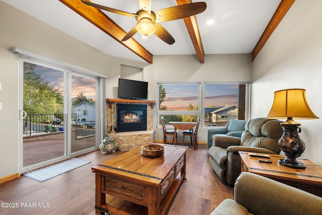 living room with ceiling fan, beam ceiling, and hardwood / wood-style floors