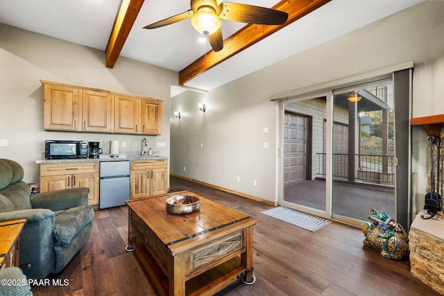 living room with ceiling fan, sink, dark hardwood / wood-style floors, and beam ceiling