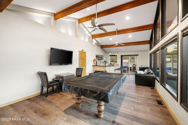 rec room featuring hardwood / wood-style flooring, billiards, high vaulted ceiling, beam ceiling, and ceiling fan