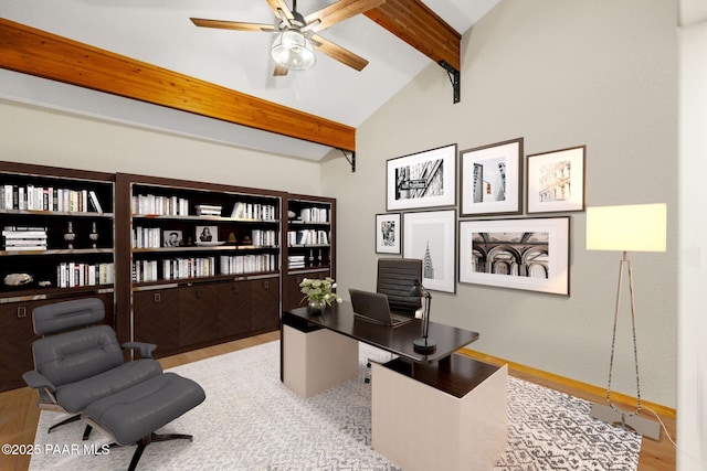 office with lofted ceiling with beams and ceiling fan