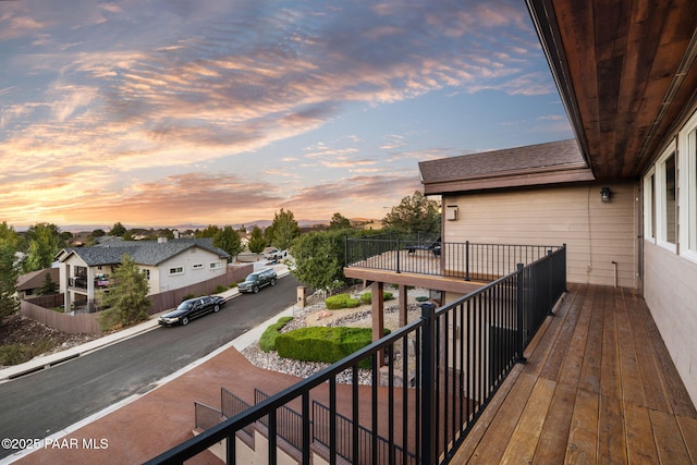 view of balcony at dusk