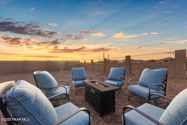 3290 Willow Butte Cir, Prescott, AZ 86301 - patio terrace at dusk with an outdoor fire pit