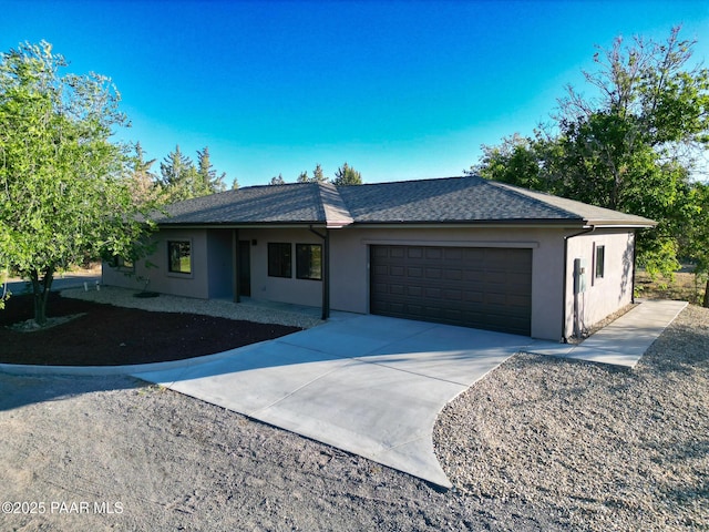 7010 N Race Track Rd, Prescott, AZ 86305 - ranch-style house with stucco siding, an attached garage, concrete driveway, and roof with shingles