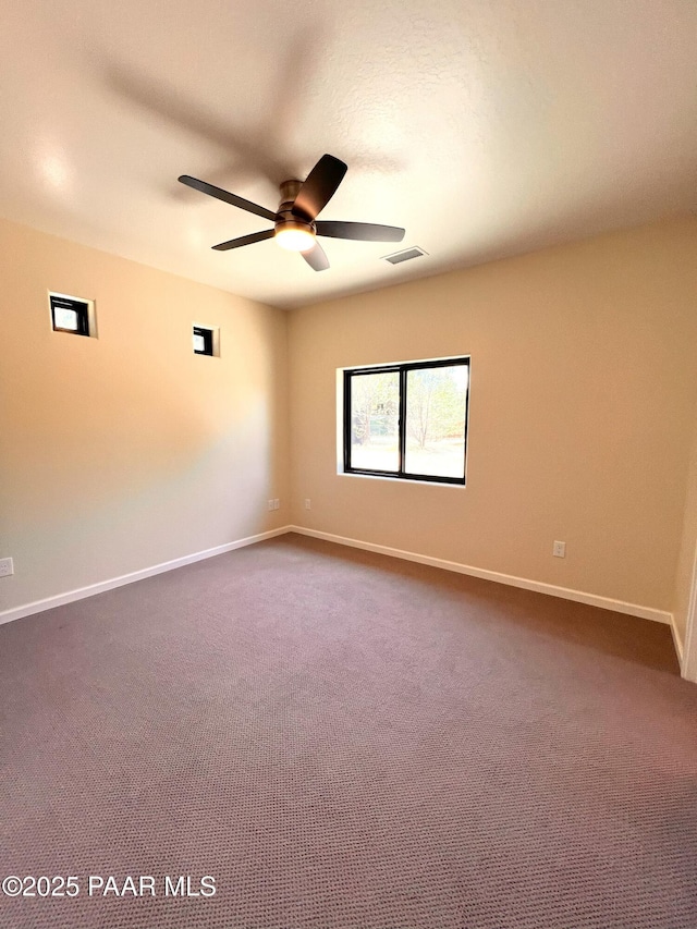 7010 N Race Track Rd, Prescott, AZ 86305 - spare room with a ceiling fan and dark colored carpet