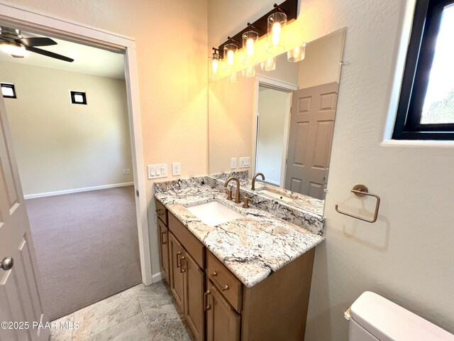 7010 N Race Track Rd, Prescott, AZ 86305 - bathroom featuring vanity, ceiling fan, and stone finish flooring