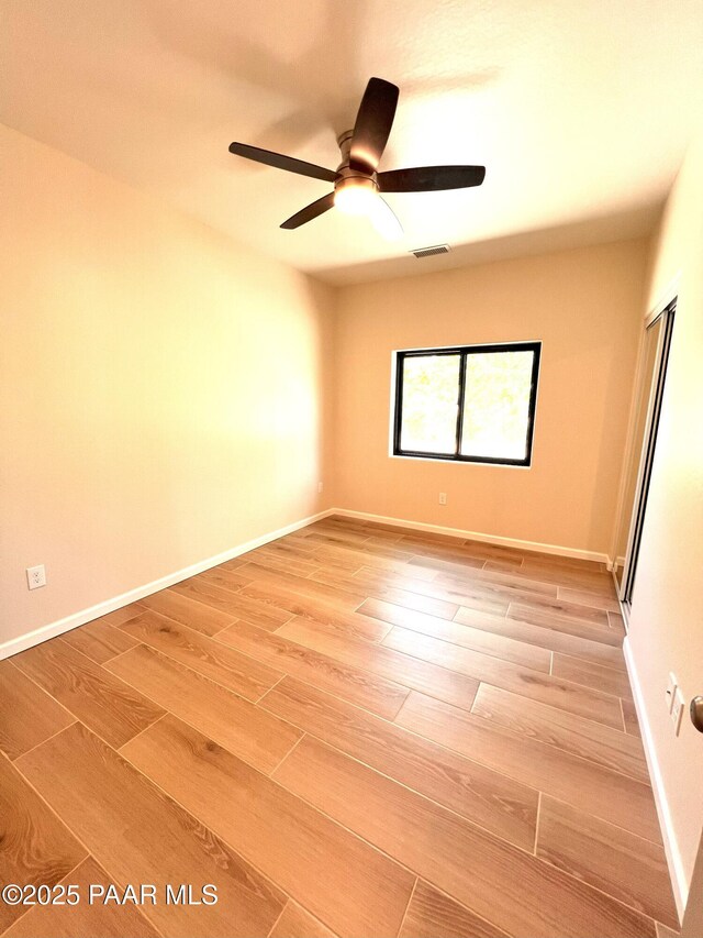 7010 N Race Track Rd, Prescott, AZ 86305 - spare room featuring a ceiling fan and light wood finished floors