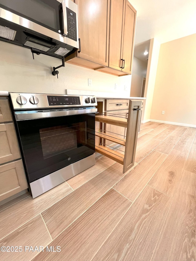 7010 N Race Track Rd, Prescott, AZ 86305 - kitchen with appliances with stainless steel finishes, wood tiled floors, and light countertops