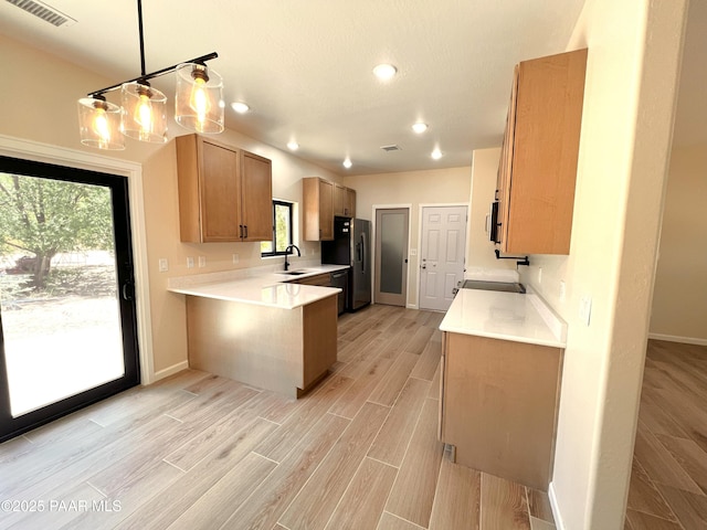 7010 N Race Track Rd, Prescott, AZ 86305 - kitchen featuring refrigerator with ice dispenser, a peninsula, light wood-type flooring, light countertops, and recessed lighting