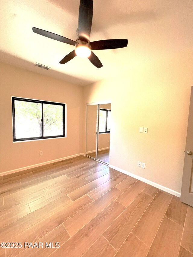 7010 N Race Track Rd, Prescott, AZ 86305 - unfurnished bedroom with light wood-style flooring and a ceiling fan