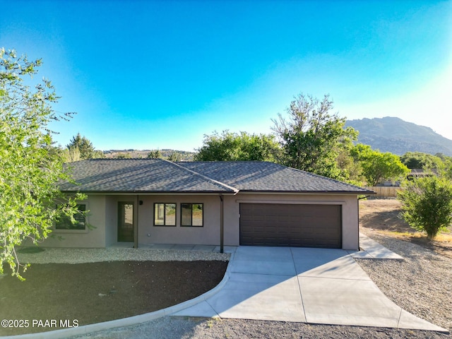 7010 N Race Track Rd, Prescott, AZ 86305 - single story home with a garage, stucco siding, concrete driveway, and a shingled roof