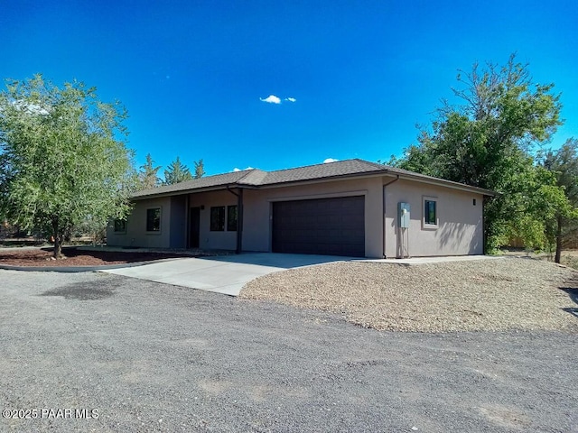 7010 N Race Track Rd, Prescott, AZ 86305 - single story home featuring stucco siding, an attached garage, and concrete driveway