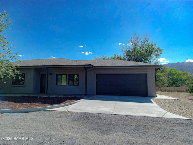 7010 N Race Track Rd, Prescott, AZ 86305 - single story home with an attached garage, driveway, and stucco siding