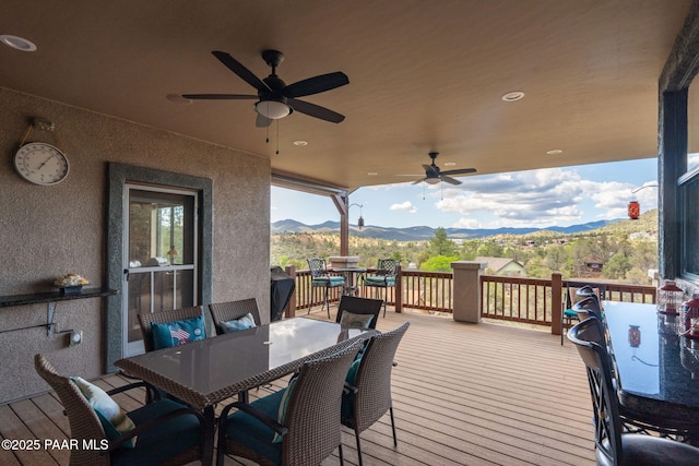 4995 Cactus Pl, Prescott, AZ 86301 - wooden terrace featuring outdoor dining space, a mountain view, and ceiling fan
