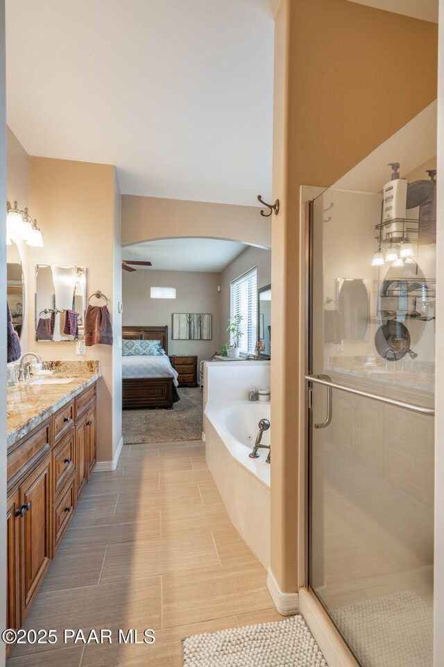 4995 Cactus Pl, Prescott, AZ 86301 - bathroom with ensuite bathroom, a bath, double vanity, and a shower stall