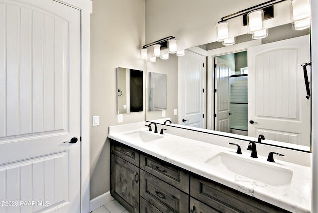12214 N Petra Cir, Prescott, AZ 86305 - full bathroom featuring double vanity, baseboards, and a shower