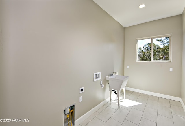 12214 N Petra Cir, Prescott, AZ 86305 - clothes washing area with electric dryer hookup, washer hookup, baseboards, light tile patterned flooring, and recessed lighting