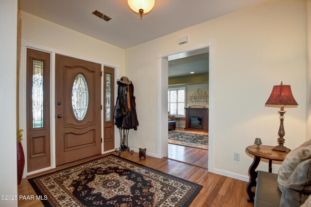 205 S Arizona Ave, Prescott, AZ 86303 - kitchen featuring brown cabinets, dishwasher, a sink, and a kitchen island