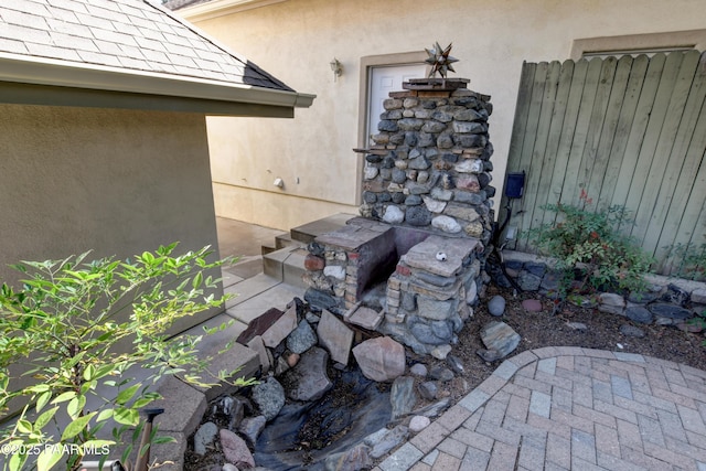 205 S Arizona Ave, Prescott, AZ 86303 - view of front of home featuring fence, covered porch, and stucco siding