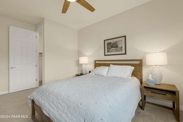 bedroom featuring ceiling fan and light carpet