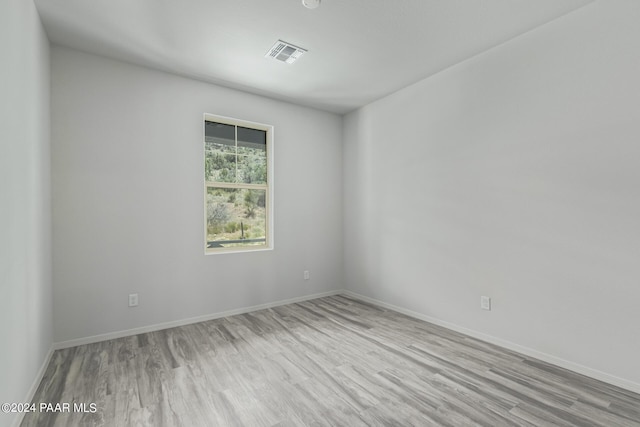 spare room with light wood-type flooring